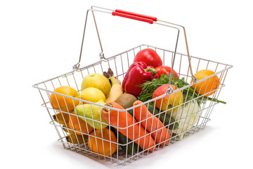 Shopping basket with food on a white