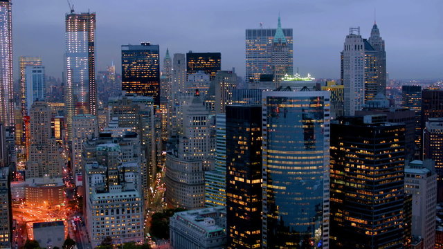 Fast approach to Manhattan at dusk, aerial shot