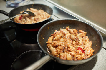 Chicken wings in a wok