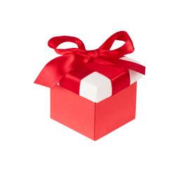 gift wrapping - boxes with red satin bow on white background