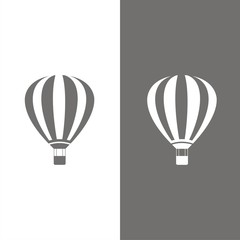 Hot air balloon icon on white and dark background