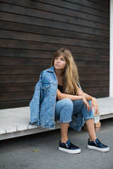 girl with beautiful hair posing in the street