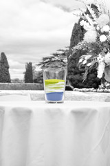 glass of mixed colour unity ceremony sands