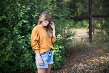 Beautiful hipster girl posing  in the park