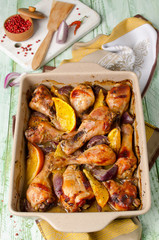Oven-roasted orange chicken with red onion