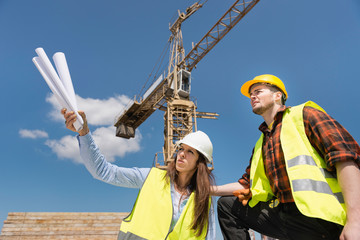 Architect and construction worker on site