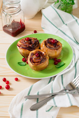 Homemade rolls with cranberry, cinnamon and citrus glaze