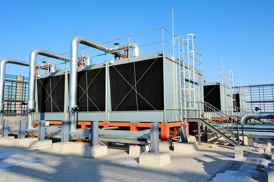 Sets of cooling towers in data center building.