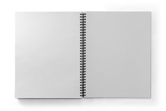Paper notebook with black metal spring isolated on white background in top view with clipping path.