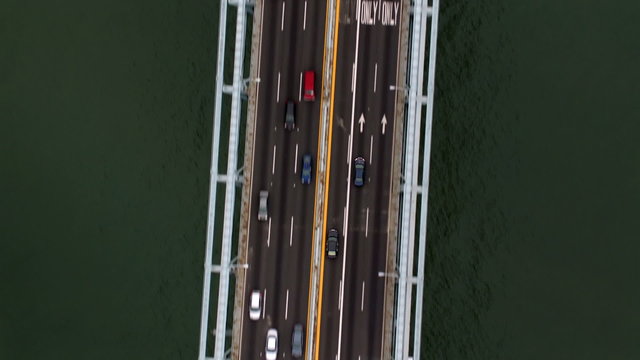 Overhead aerial shot of vehicles on bridge