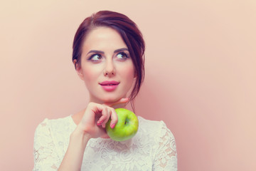 portrait of a young woman with apple