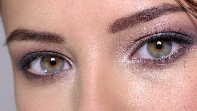 Closeup of women's eyes with color eye makeup.