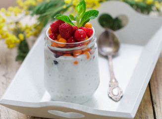 Fresh Greek yogurt with Chia seeds and fresh berries - cranberry, raspberry and sea buckthorn. Diet. Healthy Breakfast
