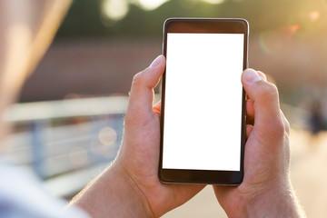 Man uses his Mobile Phone outdoor, close up