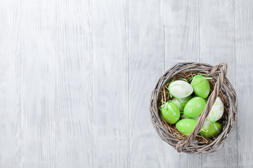 Colorful easter eggs in basket