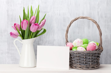 Easter eggs, greeting card and pink tulips