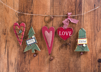 christmas wooden decorations heart and christmas bell hanging on
