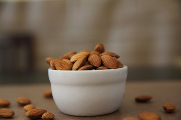 Almonds on wood background
