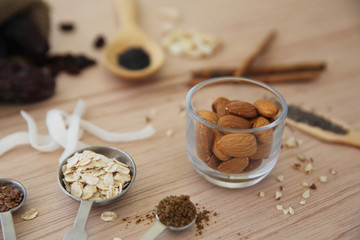 Fototapeta na wymiar nuts almond on wood background