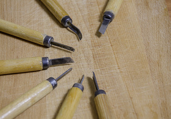 Several various scribing tools on wood surface
