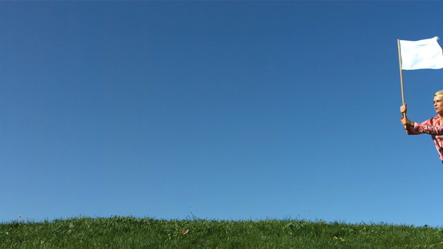 Woman running with a flag in slow mo