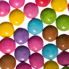 Colorful candies on white background