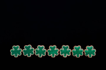 Shamrock cookies in a row
