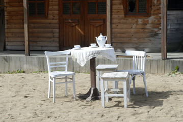 Fototapeta na wymiar White chair and table in wild west willage