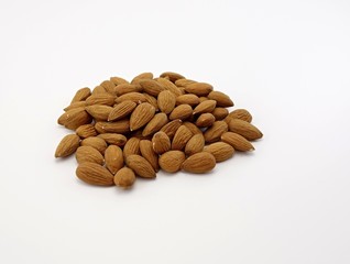 almonds scattered on a white background