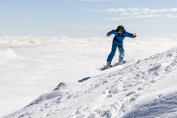 Freestyle snowboarder in the mountain