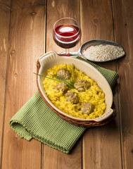 rice with saffron on the wooden table