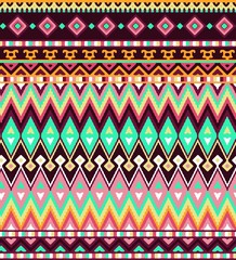 Seamless stylized stripes pattern with aztec ethnic and tribal ornament. Vector bright colors boho fashion illustration.