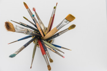 Photo of artist paint brushes in a jar