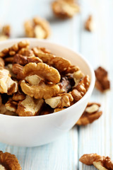 Walnut on a blue wooden table