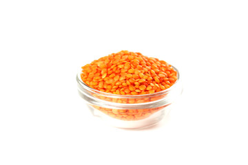 Red lentils in bowl isolated on a white