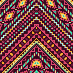 Seamless hand drawn chevron pattern with aztec ethnic and tribal ornament. Vector dark and bright colors boho fashion illustration.
