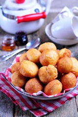 Homemade donuts on wooden background. Rustic style. 