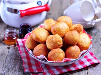 Homemade donuts on wooden background. Rustic style. 