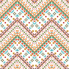 Seamless hand drawn chevron pattern with aztec ethnic and tribal ornament. Vector bright colors boho fashion illustration.
