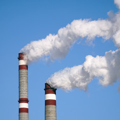 industrial chimneys emits toxic pollutants into the sky polluting environment