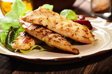 Grilled chicken breasts served with grilled paprika