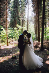 Married Couple in forest embracing