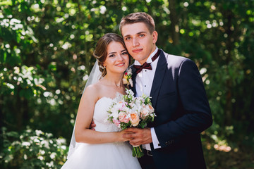 Married Couple in forest embracing