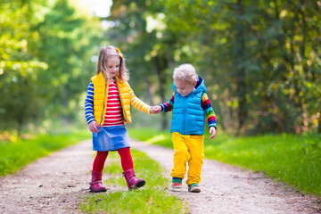 Kids running in autumn park