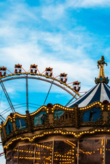 Fototapeta na wymiar Ferris wheel on the blue sky background