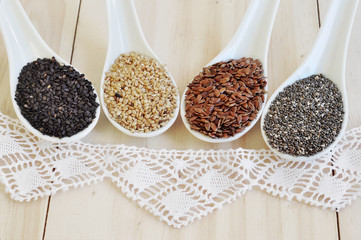 Useful seed. Proper nutrition with the addition of seeds. Chia seeds. Flax seeds. White sesame seeds. Sesame seeds black.