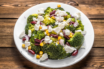 Broccoli salad with vegetables and feta cheese.