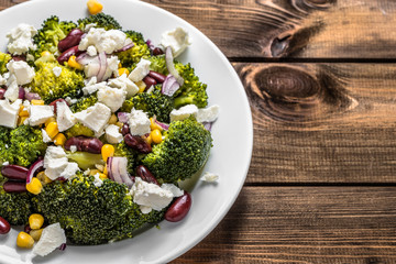Broccoli salad with vegetables and feta cheese.