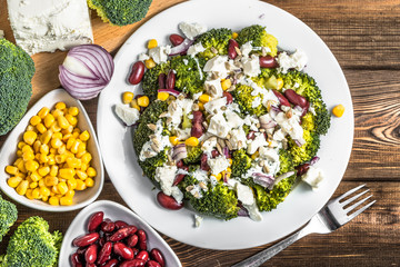 Broccoli salad with vegetables and feta cheese.