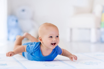 Baby boy in white nursery